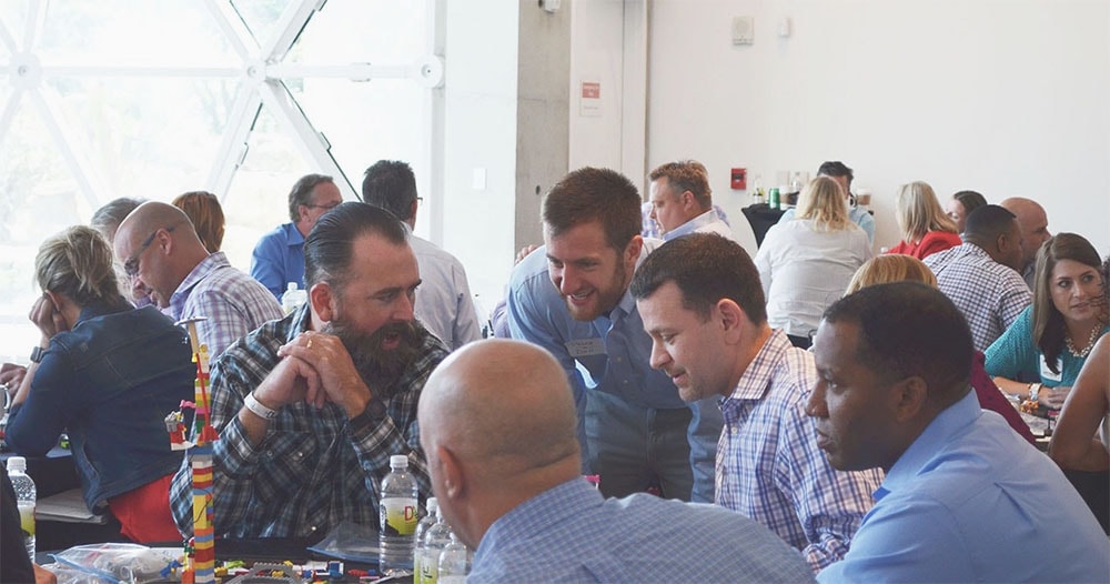 A man smiles during a design sprint.